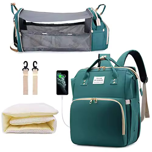 Collection of green diaper bag, baby crib, phone, and accessories 