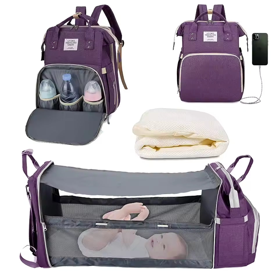 Purple baby bag with multiple compartments and accessories