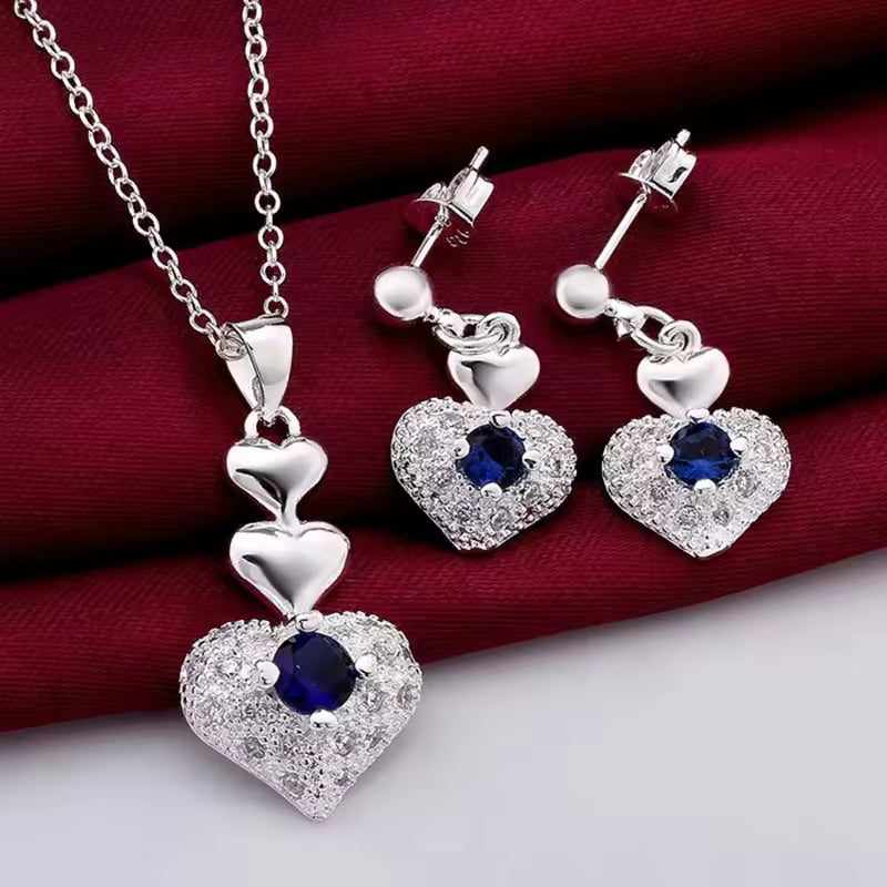 Hot popular women’s 925 sterling silver jewelry set with blue crystal heart pendant necklace and matching earrings, perfect for parties and weddings.